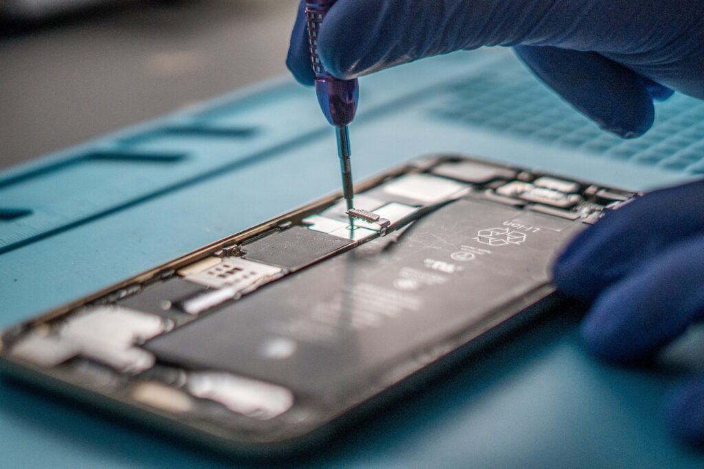 Closeup shot of a specialist repairing a mobile phone